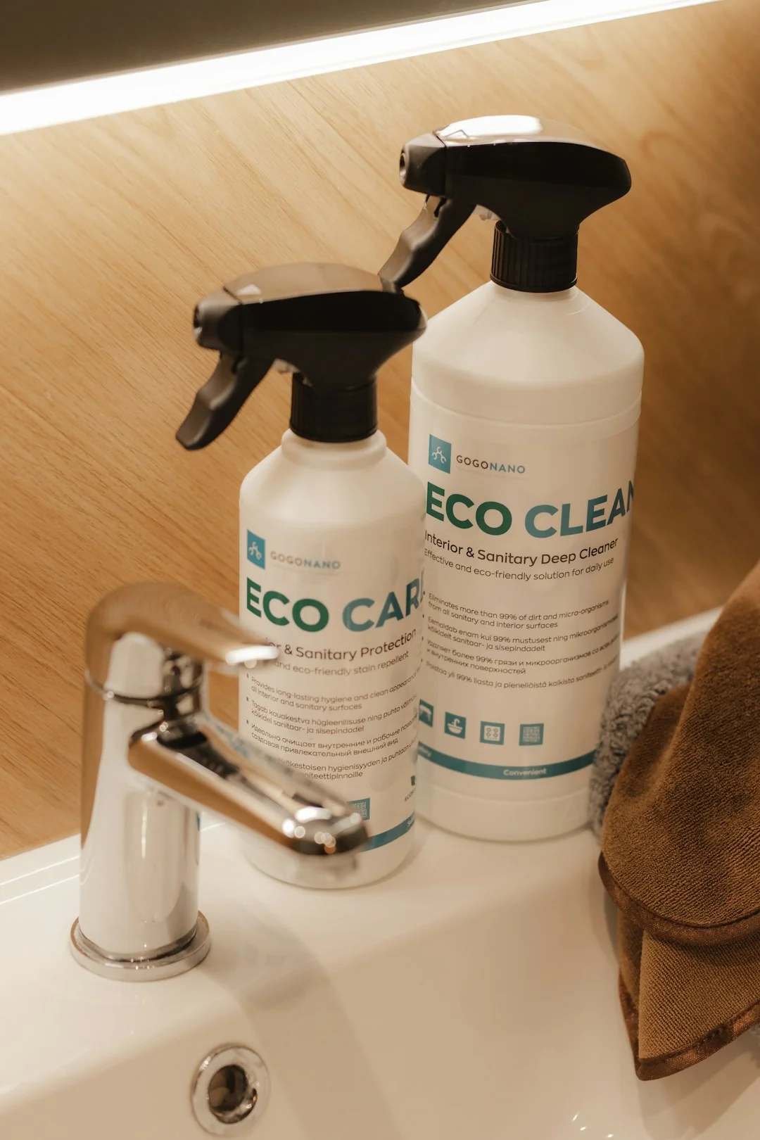 who-we-are A housekeeper elegantly arranges bed sheets in a luxurious hotel room, showcasing hospitality expertise.